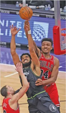  ??  ?? Bulls center Wendell Carter Jr. has been outplayed in recent games by the Kings’ Hassan Whiteside (from left), the Timberwolv­es’ Karl-Anthony Towns and the Suns’ Deandre Ayton.