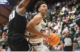  ?? NATHAN WRIGHT — LOVELAND REPORTER-HERALD ?? Colorado State’s Isaiah Rivera drives to the basket against Utah State during their game Saturday at Moby Arena in Fort Collins.