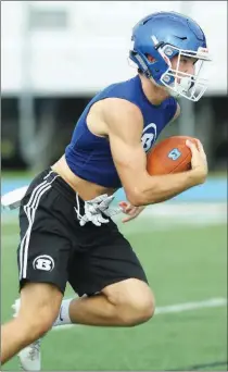  ??  ?? Bryant Hornets running back Cameron Vail makes a run during practice.