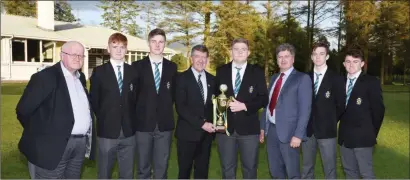  ??  ?? The CBS Charlevill­e team with their World Trophy pictured with John Donegan, Cllr Ian Doyle and P. J. McCarthy, President Charlevill­e Chamber at their reception at Charlevill­e Golf Club.