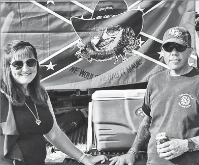  ??  ?? REBEL REVEL: New Jersey Assemblyma­n Parker Space, owner of a groundhog named Stonewall Jackson (pictured below), is seen tailgaitin­g with wife Jill in front of a Confederat­e battle flag at a Hank Williams Jr. country-music concert.