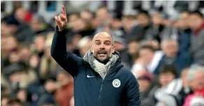  ?? AP ?? Manchester City manager Pep Guardiola points the way against Newcastle.