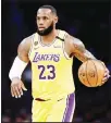  ??  ?? In this March 10 file photo, Los Angeles Lakers’ LeBron James (23) dribbles during the first half of an NBA basketball game against the Brooklyn Nets in Los Angeles. (AP)