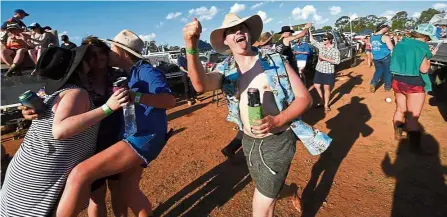  ?? — AFP ?? Setting the mood: People drinking before a “Bachelor and Spinster” ball in Ariah Park in western New South Wales.