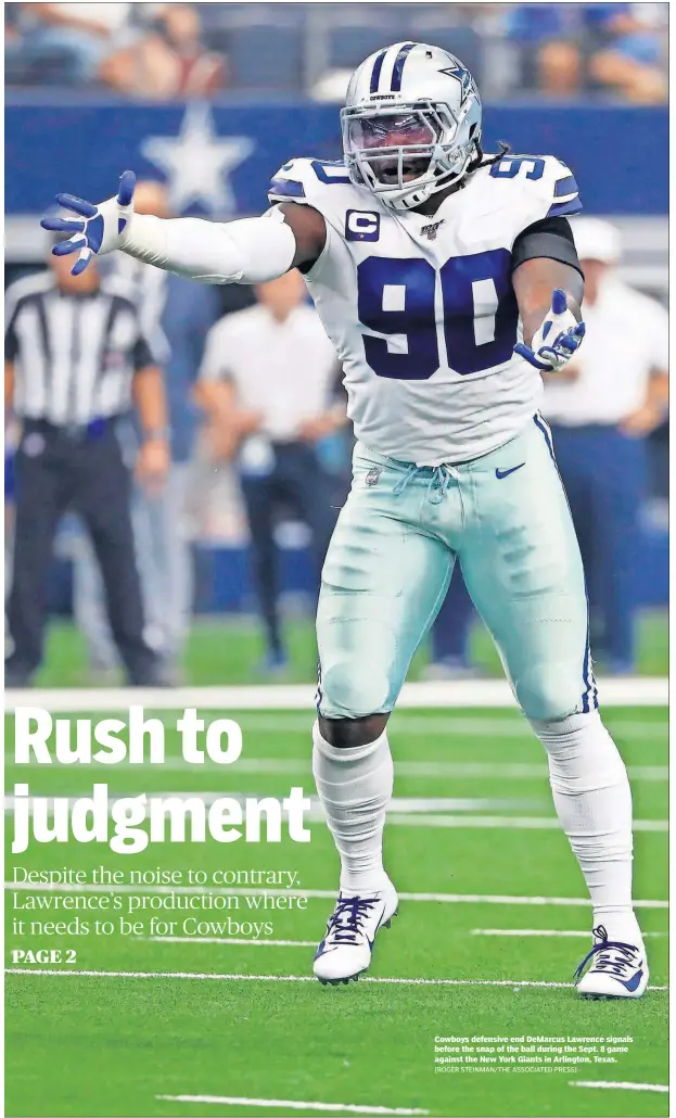  ?? [ROGER STEINMAN/THE ASSOCIATED PRESS] ?? Cowboys defensive end DeMarcus Lawrence signals before the snap of the ball during the Sept. 8 game against the New York Giants in Arlington, Texas.