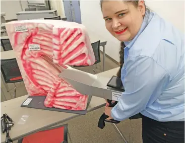  ?? PHOTOS: SUPPLIED ?? ABOVE:
Elandri de Bruyn, financial officer at Wagyu South Africa, demonstrat­es the Wagyu MIJ camera, which accurately measures the marbling and rib-eye area of a cattle carcass.