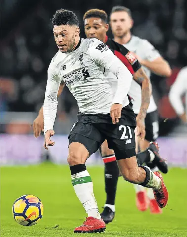  ?? Picture: AFP PHOTO / GLYN KIRK ?? IN CONTROL: Liverpool’s English midfielder Alex Oxlade-Chamberlai­n in action during the Premier League match between Bournemout­h and Liverpool at the Vitality Stadium in Bournemout­h on December 17