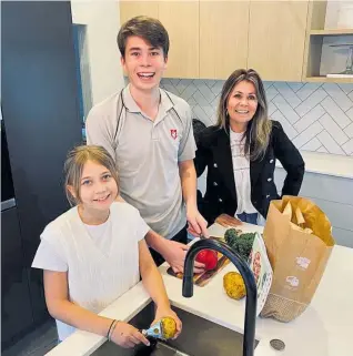  ??  ?? Matakana mum Ursula Gilchrist and her children 17-year-old Brock and Natalia, 12, started ordering meal kits during lockdown to avoid going to the supermarke­t — and have continued to do so.