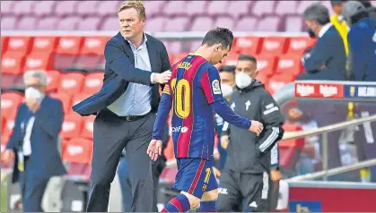  ?? GETTY IMAGES ?? Lionel Messi walks past Ronald Koeman after Barcelona’s 2-1 defeat to Celta Vigo at Camp Nou on Sunday.