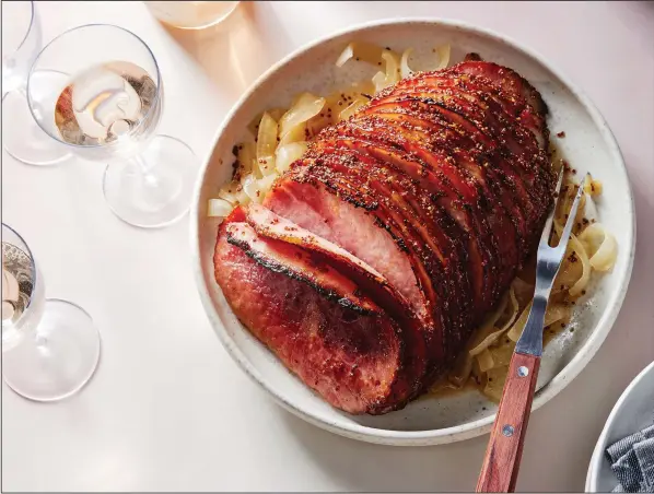  ?? (The New York Times/Bobbi Lin) ?? The pops of tiny seeds in whole grain mustard give Honey Ham’s crust a light crackle. Food styled by Monica Pierini.