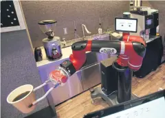  ?? AP ?? Robot barista named ‘Sawyer’ makes coffee at Henna Cafe in Tokyo’s business and shopping district of Shibuya on Friday.