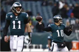  ?? JULIO CORTEZ - THE ASSOCIATED PRESS ?? Eagles quarterbac­k Carson Wentz, left, will have Jalen Hurts as his backup this year instead of Josh McCown, right. Monday, Wentz sounded plenty happy to have a young, exciting QB joining him in the room.