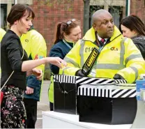  ??  ?? Scrutiny: A racegoer has her bags checked