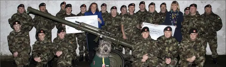  ??  ?? At the Military Barracks in Barrack Street, members of E Coy 3rd Battalion, with Lt Col Murt Larkin (OC, 3rd Battalion) and Comdt Enda McDonald (Company Commander), present cheques of €1,653.33 each to Joanne Doyle of the Jack and Jill Foundation and Fiona Sullivan of The Marie Keating Foundation.