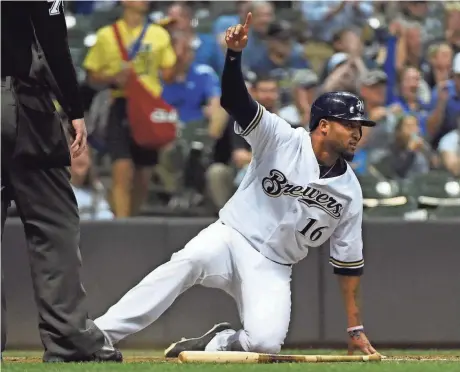  ?? BENNY SIEU / USA TODAY SPORTS ?? Brewers right fielder Domingo Santana reacts after scoring the go-ahead run in the fifth inning on a double by Jesus Aguilar.