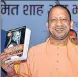  ?? ANI ?? ■ Chief Minister Yogi Adityanath releasing the book 'Amit Shah and the march of BJP' at Lok Bhawan in Lucknow on Tuesday.