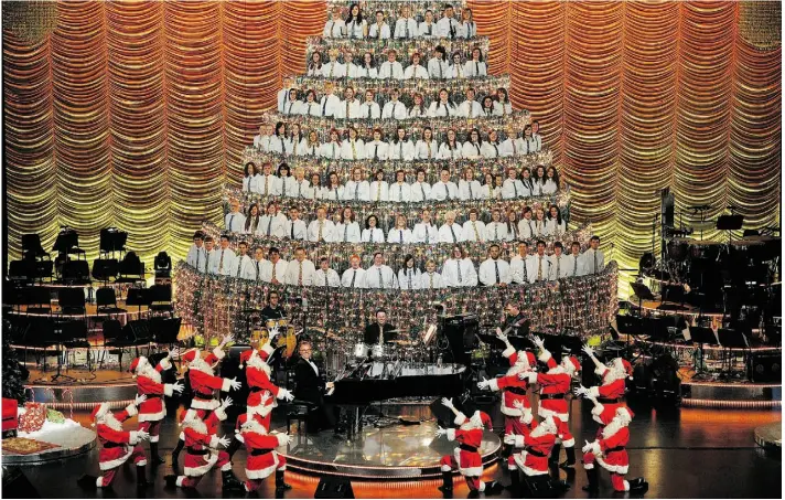  ?? Larry Wong/ Edmonton Journal file ?? The annual Edmonton Singing Christmas Tree — it’s 10.6 metres high — is back at the Jubilee Auditorium starting Thursday, with dancing Santas and an appearance by Brett Kissel.