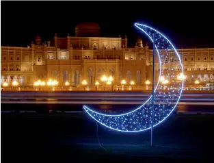  ?? Photo by M. Sajjad ?? lights and a crescent moon add more beauty to kuwait roundabout in sharjah. —