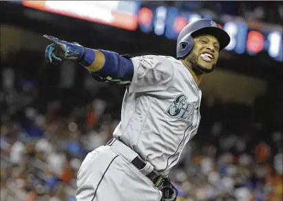  ?? LYNNE SLADKY / AP ?? The Mariners’ Robinson Cano rounds the bases after hitting a home run in the 10th inning in the American League’s 2-1 victory Tuesday night at Marlins Park. The veteran second baseman from the Dominican was named MVP for his game-deciding homer.