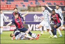  ??  ?? Bologna’s Riccardo Orsolini competes for the ball with FC Internazio­nale Milano’s Nicolo Barella during the Italian Serie A soccer match between Bologna and Inter Milan at the Renato Dall’Ara stadium in Bologna, Italy, on April 3. (AP)