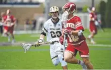  ?? Tom McCaffrey, Special to The Denver Post ?? University of Denver midfielder Colton Jackson carries the ball during the Pioneers’ game against Notre Dame in the NCAA lacrosse tournament Sunday.