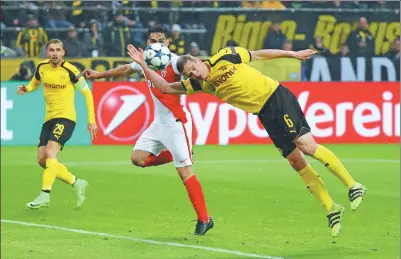  ?? KAI PFAFFENBAC­H / REUTERS ?? Borussia Dortmund’s Sven Bender heads into his own net to put Monaco up 2-0 in their UEFA Champions League quarterfin­al, first-leg match in Dortmund, Germany, on Wednesday. Monaco won 3-2.