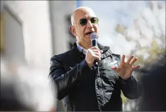  ?? NICK COTE / NEW YORK TIMES ?? Jeff Bezos, Amazon’s chief executive, had estimated wealth of $90.6 billion early on Thursday to briefly make him the world’s richest person, according to a real-time list of billionair­es by Forbes.com, which has tallied fortunes for decades.