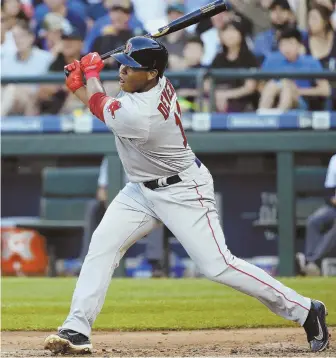  ?? AP PHOTO ?? DEBUT TIME: Rafael Devers flies out to center field in his first major league at-bat in the third inning last night in Seattle. Devers later drew a walk and scored to help key a three-run Red Sox rally in the sixth inning.