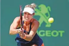  ?? AP ?? Angelique Kerber hits a double-fisted backhand return during her Miami Open win over Shelby Rogers on Sunday.