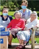  ??  ?? Virus free: Staff at Hampton House with residents Edna Groves and Murial Roberts