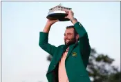  ?? MATT SLOCUM — THE ASSOCIATED PRESS ?? Scottie Scheffler holds the trophy after winning the Masters golf tournament at Augusta National Golf Club Sunday, in Augusta, Ga.