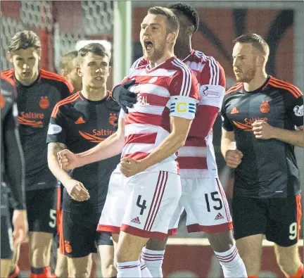  ?? Picture: SNS ?? SPEAK OF THE DEVLIN: Hamilton’s Michael Devlin celebrates with his team-mates after scoring the winner.