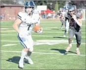  ?? SHERRY LAVARS — MARIN INDEPENDEN­T JOURNAL ?? Marin Catholic’s Greer Arthur runs to the end zone for a touchdown after catching a pass during their MCAL game against Redwood in Larkspur on Saturday.