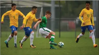  ??  ?? Seamas Keogh from Grange, captain of the Republic of Ireland U16s, in action with Brazil’s Fabinho, Joao Peglow, and Reiner during the Internatio­nal Friendly match between Republic of Ireland and Brazil at the AUL Complex in Dublin. Photo by Piaras Ó...
