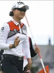  ?? Paul Ellis/Getty Images ?? Minjee Lee has a one-shot lead over Mamiko Higa at Royal Lytham. Five other players were two shots back.