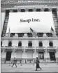  ?? Carolyn Cole Los Angeles Times ?? SNAP is making cuts amid a restructur­ing. Above, at the NYSE on its stock debut last year.