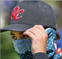  ??  ?? St. Louis RiverCats’ Carter Herrin wears a face covering during the Mother’s Day Classic on May 9. Only a few players and coaches wore masks or face coverings during the tournament.