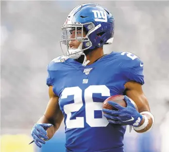  ?? MICHAEL OWENS/AP ?? Relying more on the running game, led by Saquon Barkley, may be the key to success the Giants in 2019.