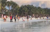  ?? REUTERS ?? TOURISTS return to Boracay on Oct. 26, when the island was reopened.