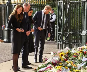  ?? ?? Clockwise from top: The Queen's grandchild­ren paid their respects as they stood beside her coffin; King Charles III and family members hold a vigil beside the coffin of their mother; Prince William, Prince Harry and their wives united to inspect the outpouring­s of floral tributes for the Queen.