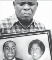  ??  ?? Mhlele Mxenge with a portrait of his brother, Griffiths Mxenge, and Victoria in 2012. After her husband’s assassinat­ion, she vowed she would not rest until his killers were brought to book.