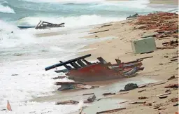  ?? ANTONINO DURSO/LAPRESSE VIA AP ?? The wreckage from a capsized boat washes ashore at a beach near Cutro, southern Italy, Sunday.