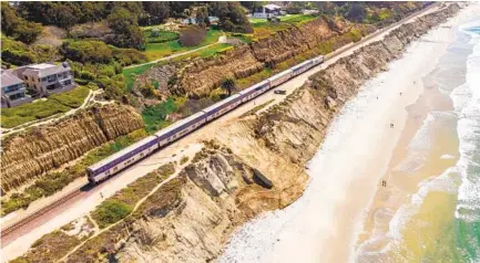  ?? JARROD VALLIERE U-T ?? A bluff collapse Feb. 28 in Del Mar below train tracks used for public and commercial transporta­tion has spurred emergency repairs to safeguard the tracks. The work was planned before the collapse as part of the fifth phase of the ongoing bluff stabilizat­ion project.