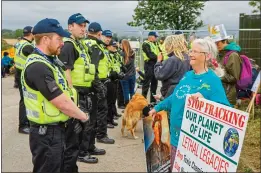  ??  ?? FRONT LINE: Police at a fracking protest near Pickering, North Yorkshire