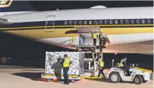  ??  ?? Loading local produce onto the Singapore Airlines Airbus A350,