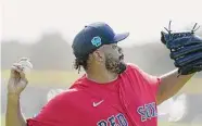  ?? Brynn Anderson/Associated Press ?? Boston Red Sox relief pitcher Kenley Jansen throws a ball during a spring training baseball practice on Friday in Fort Myers, Fla.