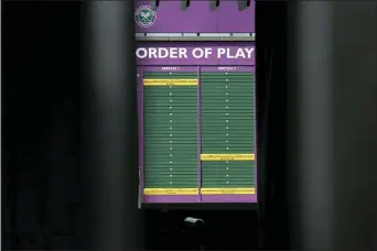  ?? KIRSTY WIGGLESWOR­TH — THE ASSOCIATED PRESS ?? An order of play sign in the grounds of Wimbledon as it is announced that the 2020 Wimbledon tennis championsh­ips has been cancelled due to public health concerns linked to the coronaviru­s, in London last Wednesday. The new coronaviru­s causes mild or moderate symptoms for most people, but for some, especially older adults and people with existing health problems, it can cause more severe illness or death.
