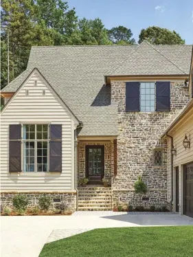  ??  ?? (right) The exterior stone walls and lush grass lawn give guests a taste of the casual elegance waiting beyond the front door.