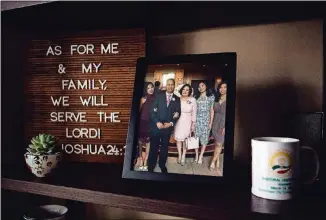  ?? NEW JERSEY. CALLA CALLA KESSLER/ KESSLER/ THE THE NEW NEW YORK YORK TIMES TIMES ?? A photo of Gabrielle Dawn Luna’s family, including her late father Tom Omaña Luna, is displayed at her home in Woodbridge, New Jersey.