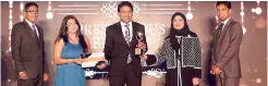  ??  ?? Maliban Group CEO Ravi Jayawarden­a receiving the Prestigiou­s Brands of Asia Award flanked by Maliban Biscuit Marketing Manager Kasun Thotagamuw­a (extreme left) and Maliban Agri Marketing Manager Gotabaya Attanayake (extreme right)